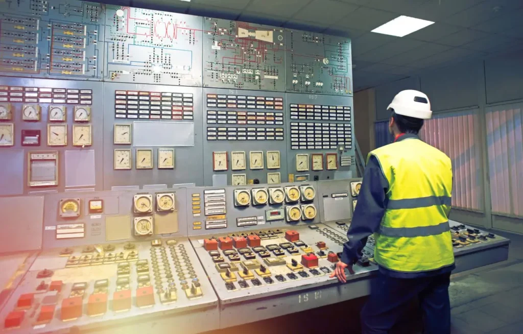 Person standing in front of an example of Human-Machine Interface.