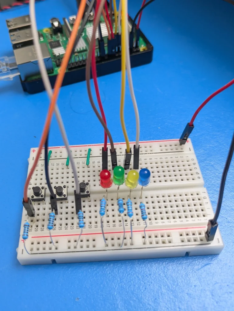 An image showing all of the hardware on our breadboard wired to our Pi's GPIO