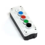 Maple Systems PB01005A 5 hole white pushbutton controller box with 1 illuminated button, 3 metal ring buttons and 1 selector switch installed.