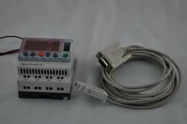 Millenium 3 PLC with a 9-pin D-Sub serial cable connected to its communication port.