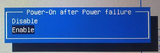 Screenshot of the Aptio Setup Utility Power-On after Power Failure dialog showing Disable and Enable options for automatically restoring power after an outage.