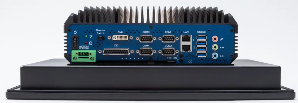 Rear I/O view of the PC2300B Series industrial panel PC showing DC power input, DVI-I video output, four serial ports, digital I/O, Ethernet, USB ports, audio connections, and remote switch controls.