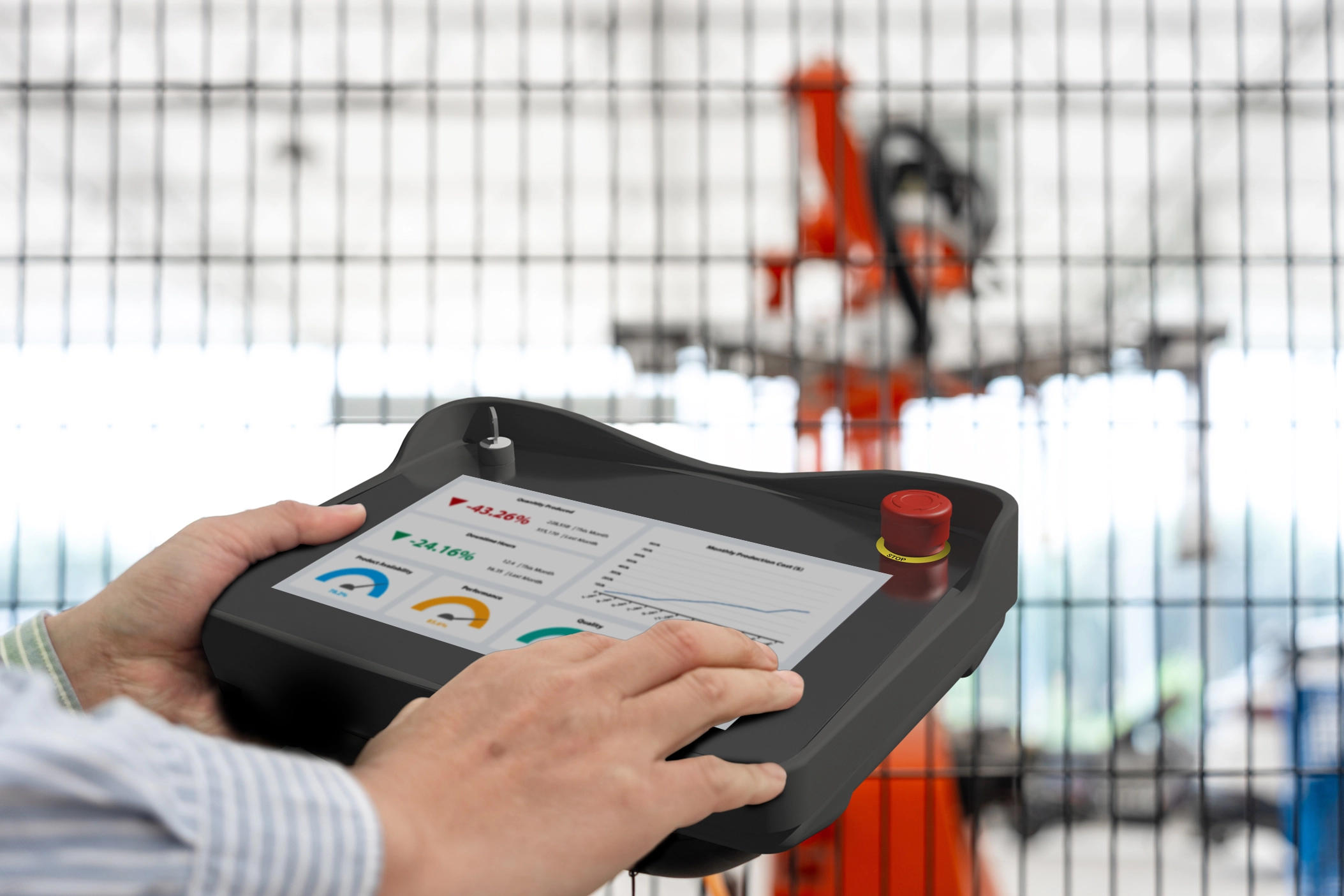 An image of an Industrial worker using a cMT3106XM to train an industrial Robot