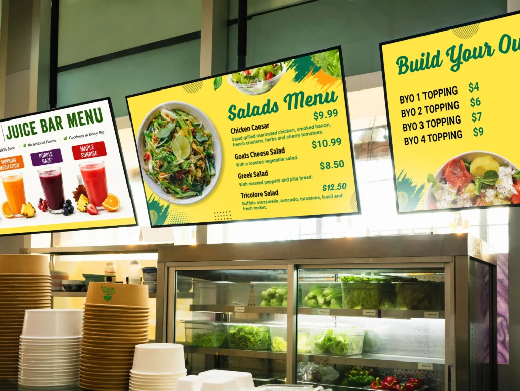 Restaurant-triple-menu-salad-bar A picture of a quick service restaurant with multiple digital menu boards