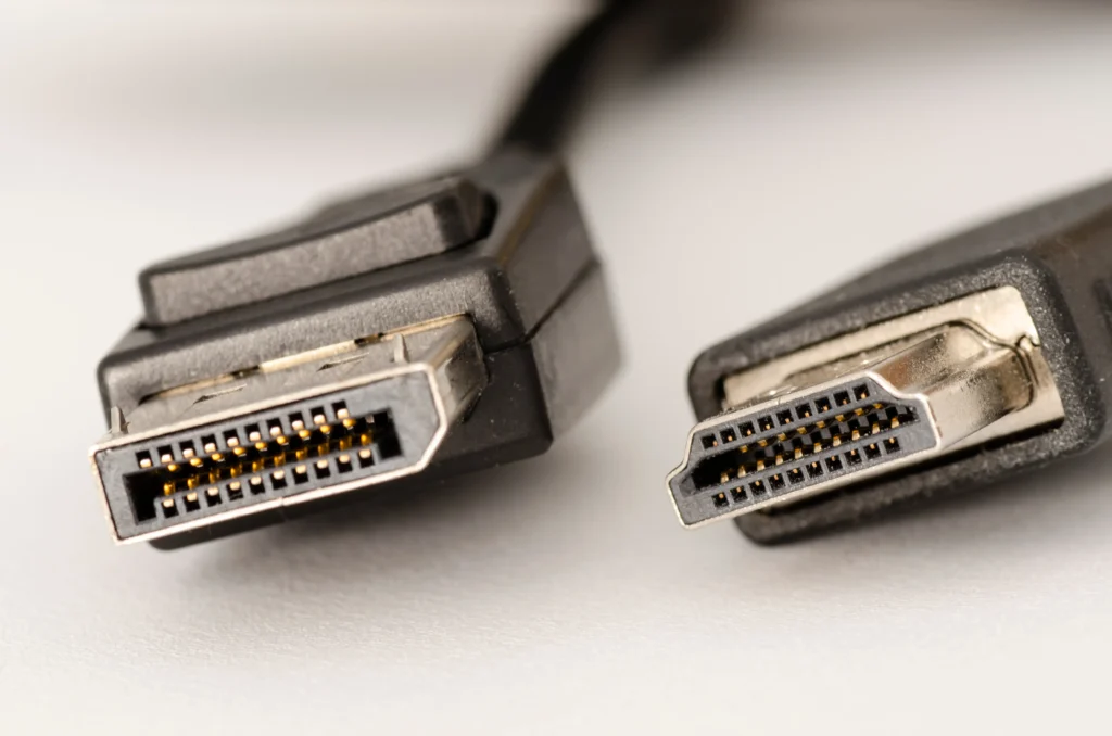 A close-up of HDMI and DisplayPort cables.