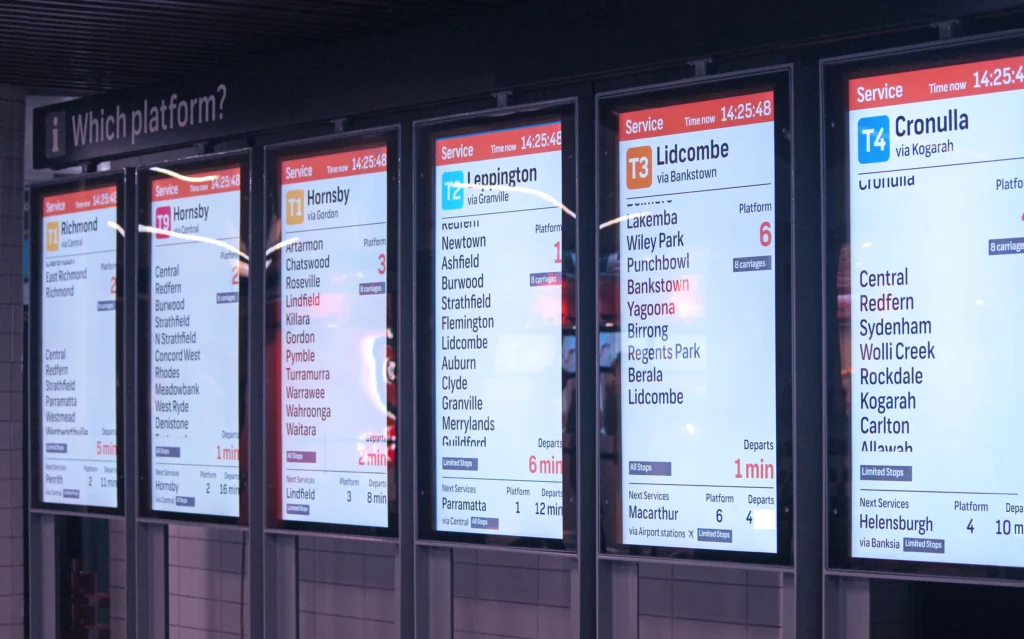 Digital Signage for Transportation A subway terminal with digital signs listing all of the stops.